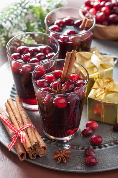 Glass of mulled wine with cranberry and spices, winter drink — Stock Photo, Image