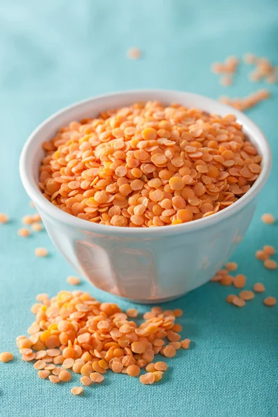 Raw healthy red lentils in bowl — Stock Photo, Image