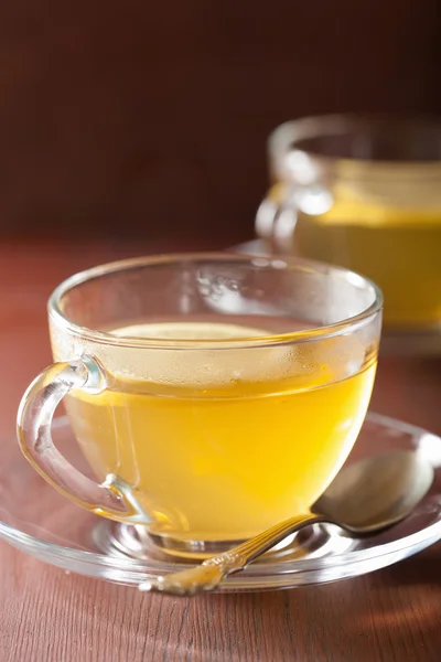 Hot lemon ginger tea in glass cup — Stock Photo, Image