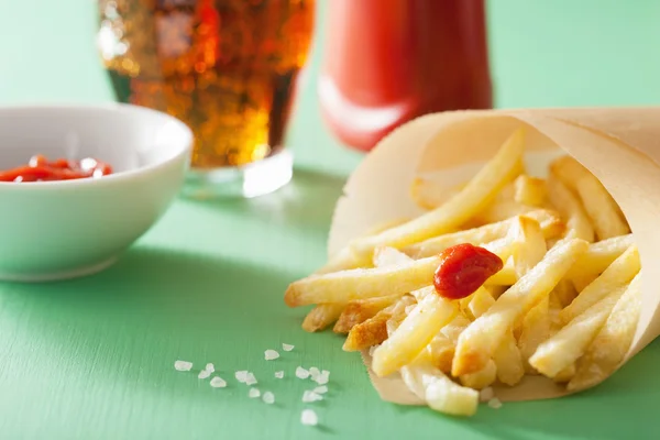 French fries with ketchup over green background — Stock Photo, Image