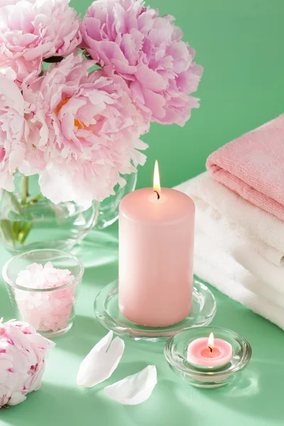 Bath and spa with peony flowers candles towels — Stock Photo, Image