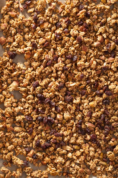 Homemade healthy granola on backing paper background — Stock Photo, Image