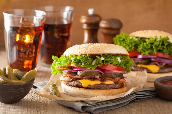 Bacon cheese burger with pickles tomato onion — Stock Photo, Image