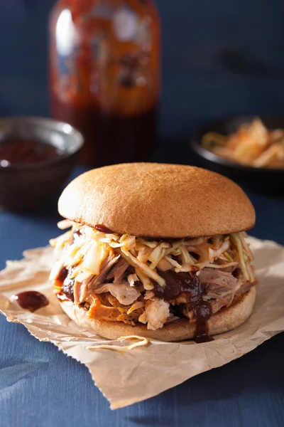 homemade pulled pork burger with coleslaw and bbq sauce