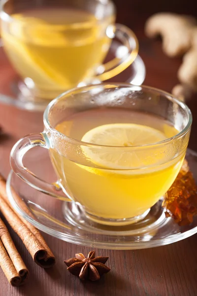 Hot lemon ginger cinnamon tea in glass cup — Stock Photo, Image