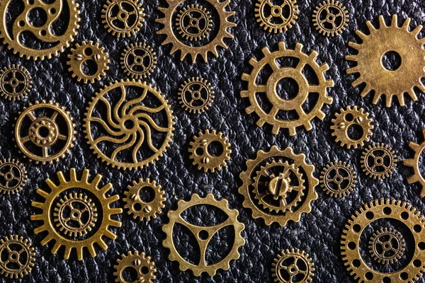 steampunk mechanical cogs gears wheels on wooden background