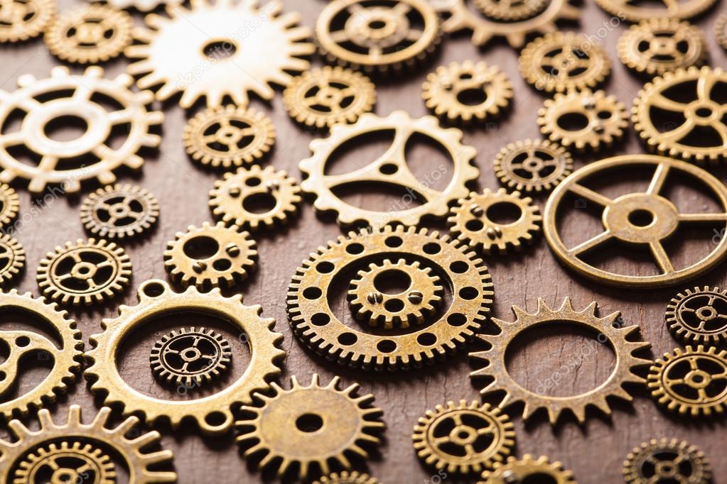 Steampunk mechanical cogs gears wheels on wooden background — Stock