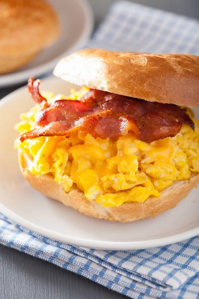 Breakfast sandwich on bagel with egg bacon cheese — Stock Photo, Image