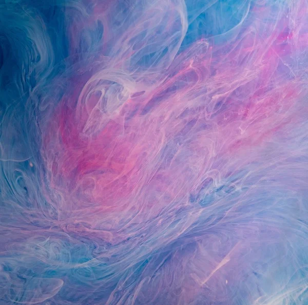Blauw roze wolken van inkt in vloeistof — Stockfoto