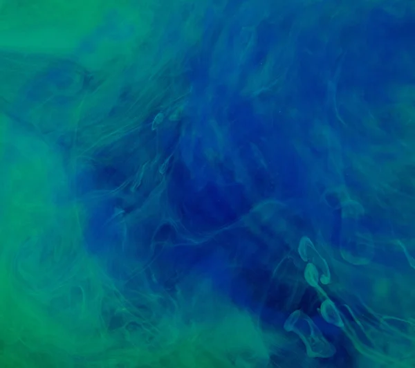 Nuages d'encre bleu-vert dans le liquide — Photo