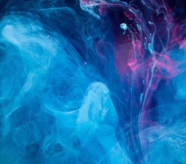 Smoky blue and pink ink in motion on water — Stock Photo, Image