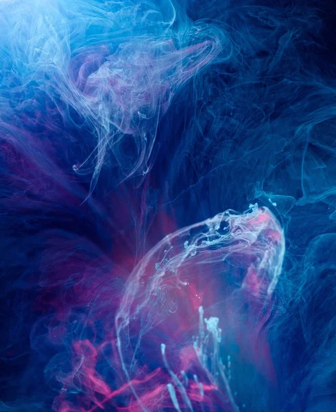 Smoky blue and pink ink in motion on water — Stock Photo, Image