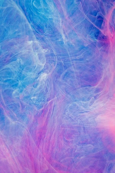 Blauw roze wolken van inkt in vloeistof — Stockfoto