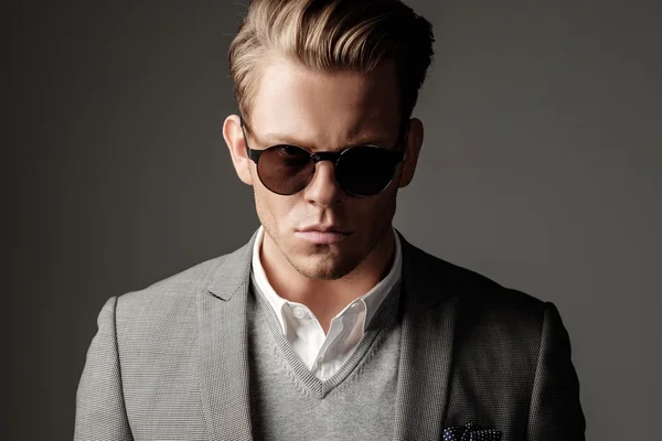 Confident sharp dressed man in black suit — Stock Photo, Image