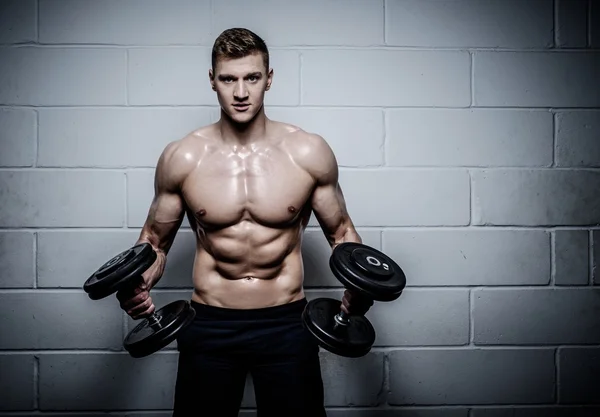 Athletic man doing exercises — Stock Photo, Image