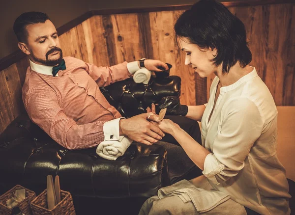 Old-fashioned man doing male manicure — Stock Photo, Image