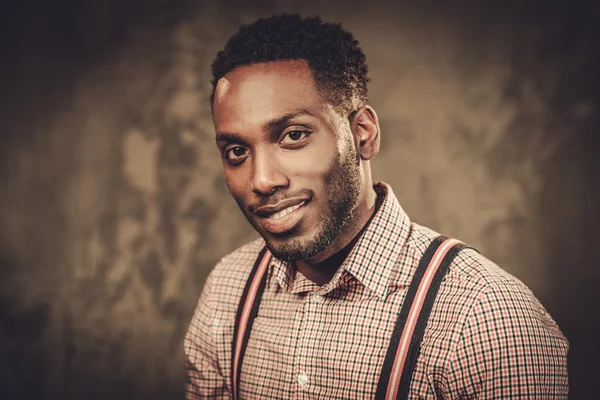 Stylish young black man with suspenders — Stock Photo, Image