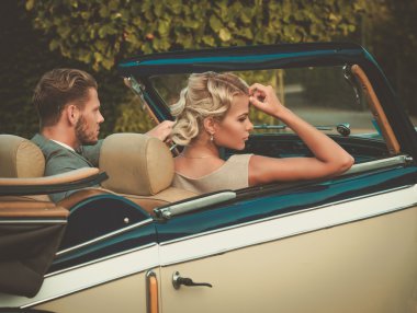 couple in a classic convertible  clipart