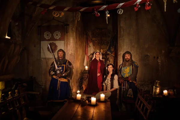 Medieval queen with her courtier and knights — Stock Photo, Image