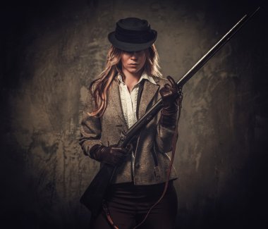 Lady with shotgun and hat  clipart