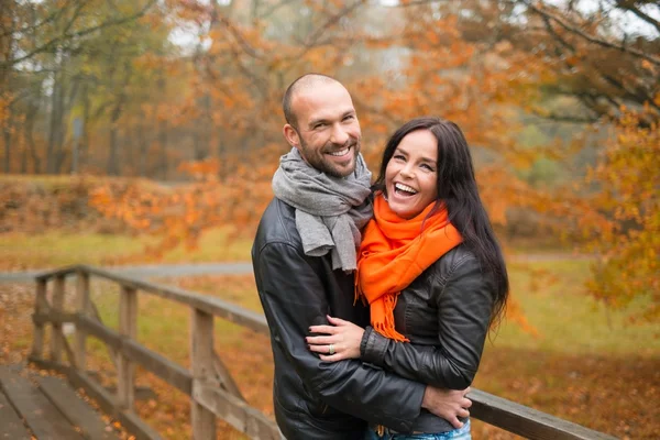 Happy middle-aged couple outdoors on beautiful autumn day — Stock Photo, Image