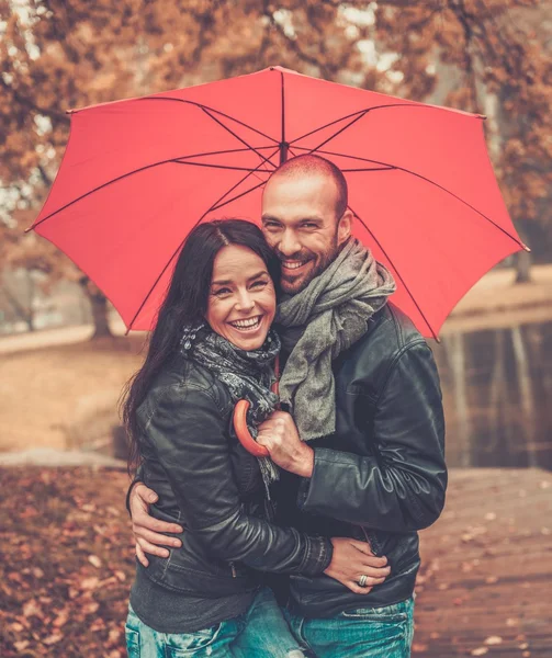 Happy middle-aged couple outdoors on beautiful autumn day — Stock Photo, Image