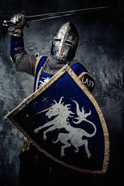 Medieval knight against stone wall — Stock Photo, Image