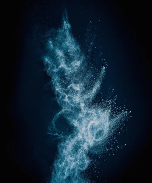 Blue powder exploding isolated on black — Stock Photo, Image