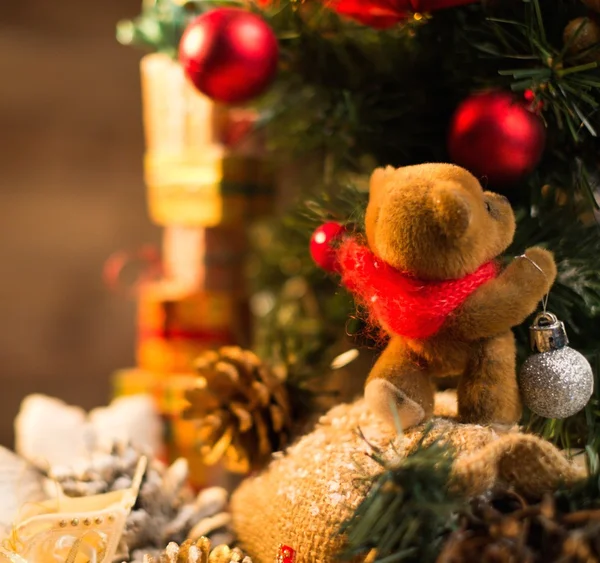 Christmas still life with teddy bear decorating tree — Stock Photo, Image