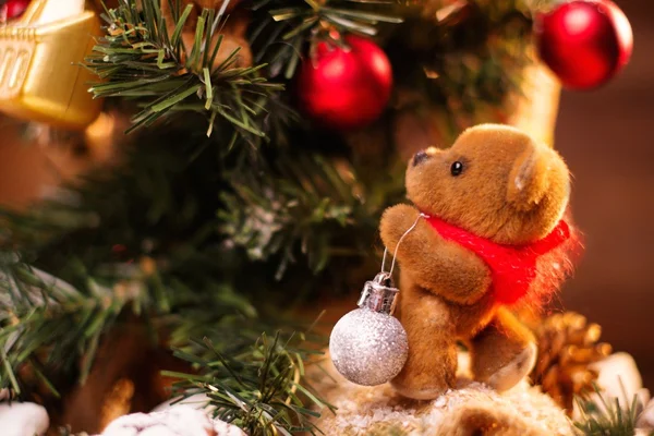 Christmas still life with teddy bear decorating tree — Stock Photo, Image