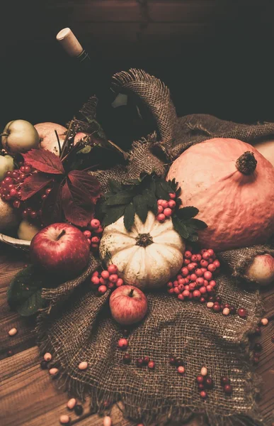 Thanksgiving day autumnal still life with bottle of wine — Stock Photo, Image