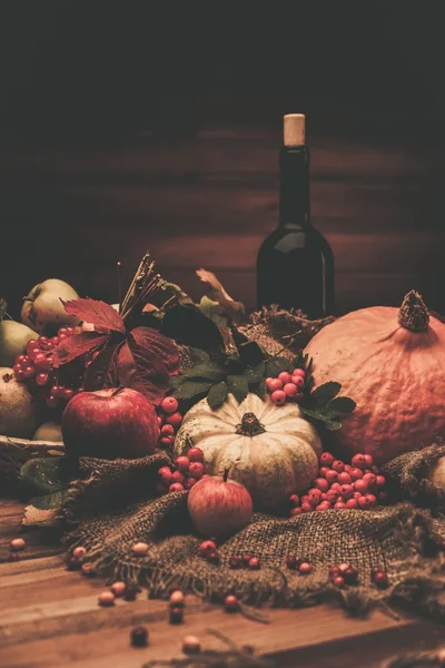 Thanksgiving day autumnal still life with bottle of wine — Stock Photo, Image