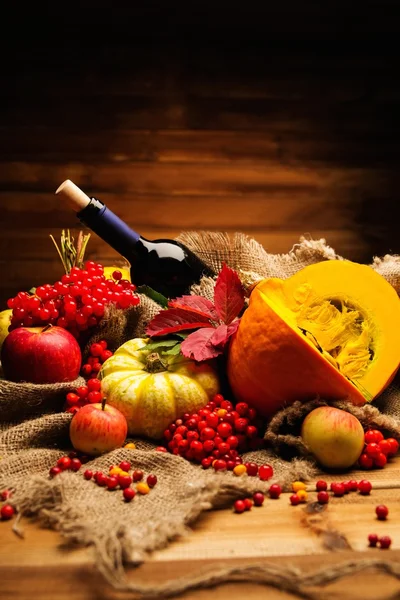Thanksgiving day autumnal still life with bottle of wine — Stock Photo, Image