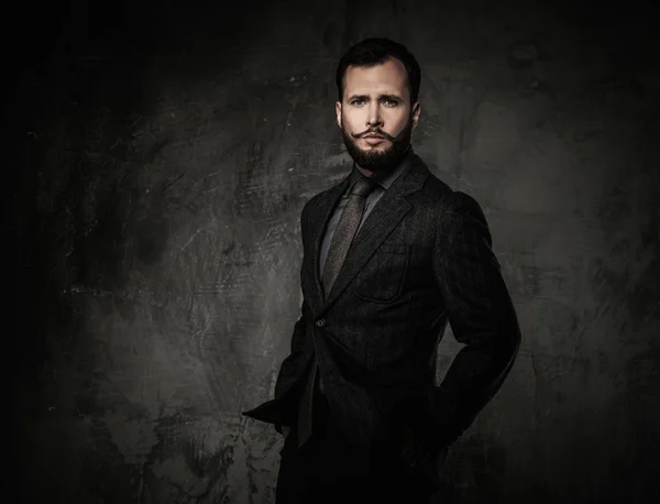 Handsome well-dressed with glass of beverage — Stock Photo, Image