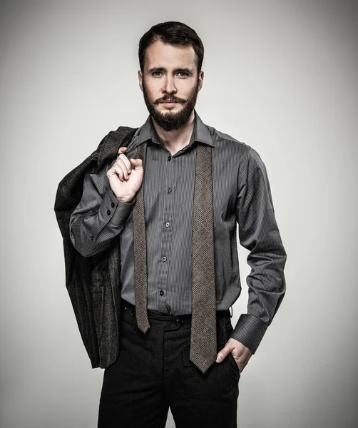 Jóképű férfi szakáll és kabát — Stock Fotó