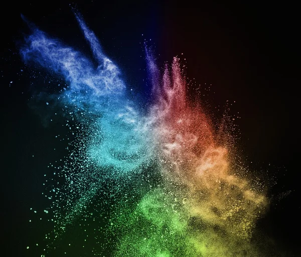 Polvere colorata esplode isolato su nero — Foto Stock
