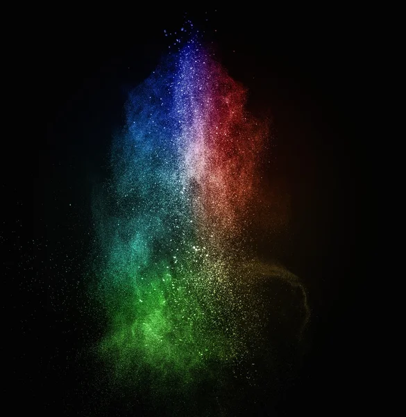 Colourful powder exploding isolated on black — Stock Photo, Image