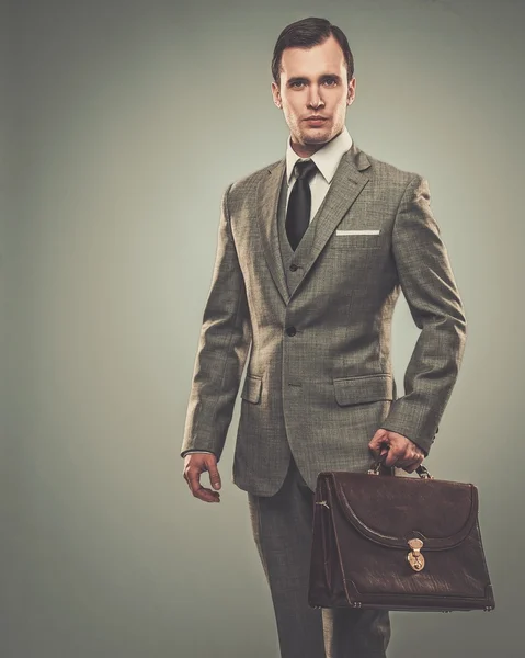 Well-dressed man with jacket over shoulder — Stock Photo, Image