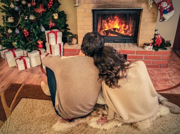 Happy family near Christmas tree in house interior — Stock Photo, Image