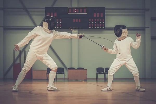 Little girl fencer and her trainer — Stock Photo, Image