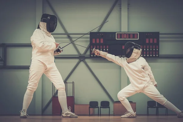 Little girl fencer and her trainer — Stock Photo, Image