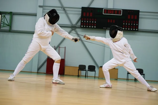 Little girl fencer and her trainer — Stock Photo, Image