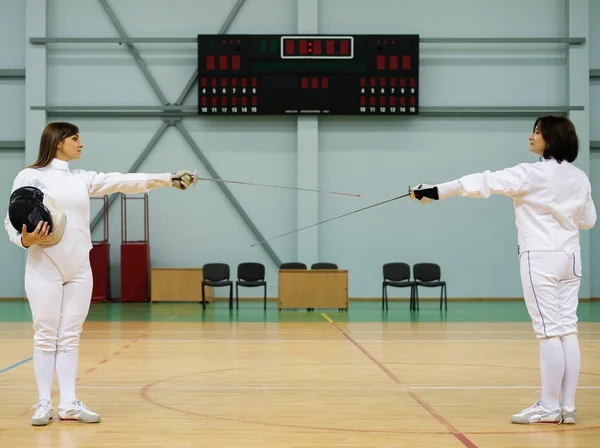 Young woman fencer and her trainer — Stock Photo, Image