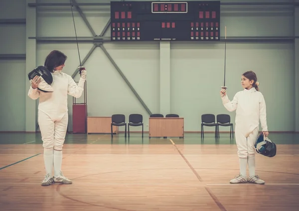 Little girl fencer and her trainer — Stock Photo, Image
