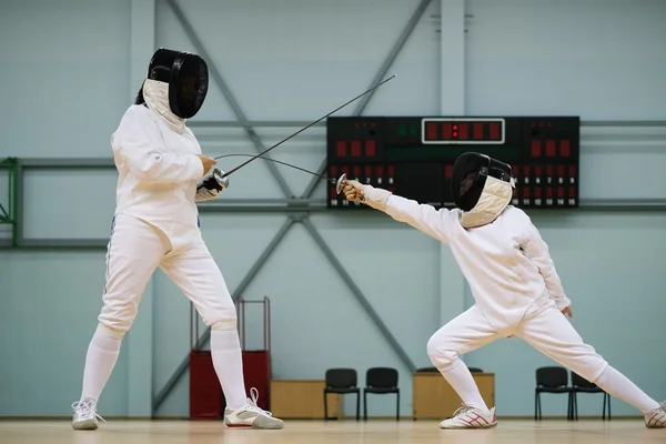 Little girl fencer and her trainer — Stock Photo, Image