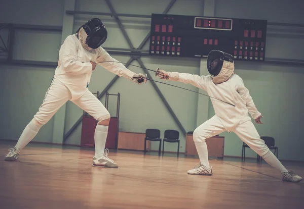 Little girl fencer and her trainer — Stock Photo, Image