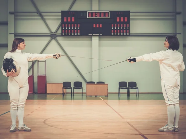 Young woman fencer and her trainer — Stock Photo, Image