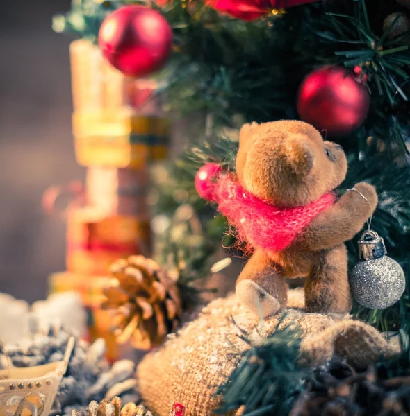 Christmas still life with teddy bear decorating tree — Stock Photo, Image