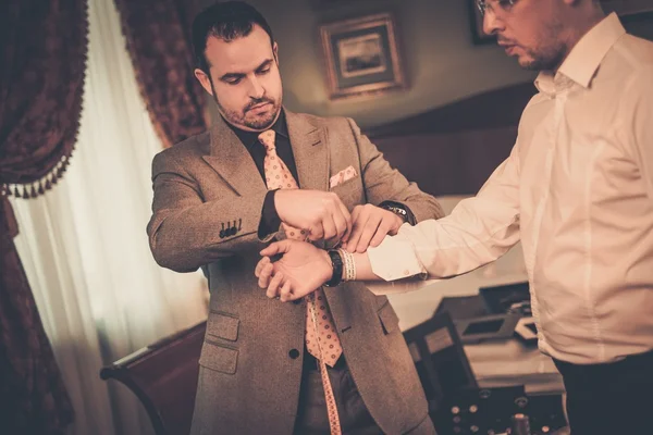 Tailor measuring client for custom made suit tailoring — Stock Photo, Image