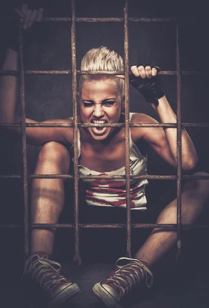 Troubled teenager girl behind bars — Stock Photo, Image